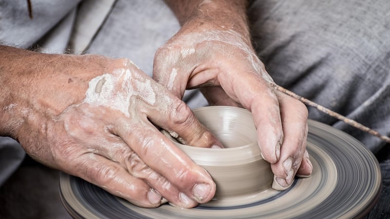 Artisan crafting pottery